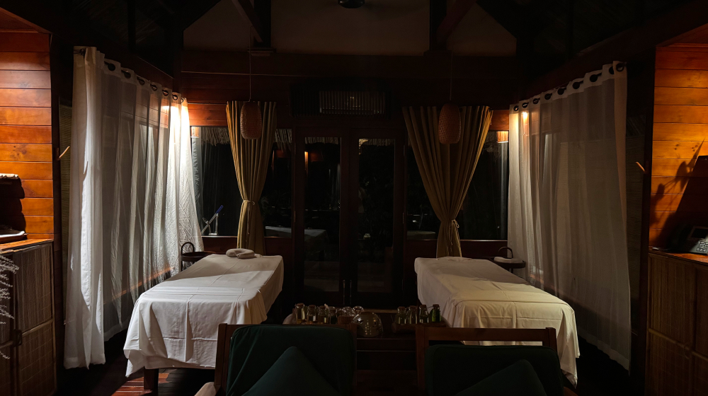 Outdoor spa treatment room surrounded by tropical nature at L'Alya Ninh Van Bay wellness resort Vietnam