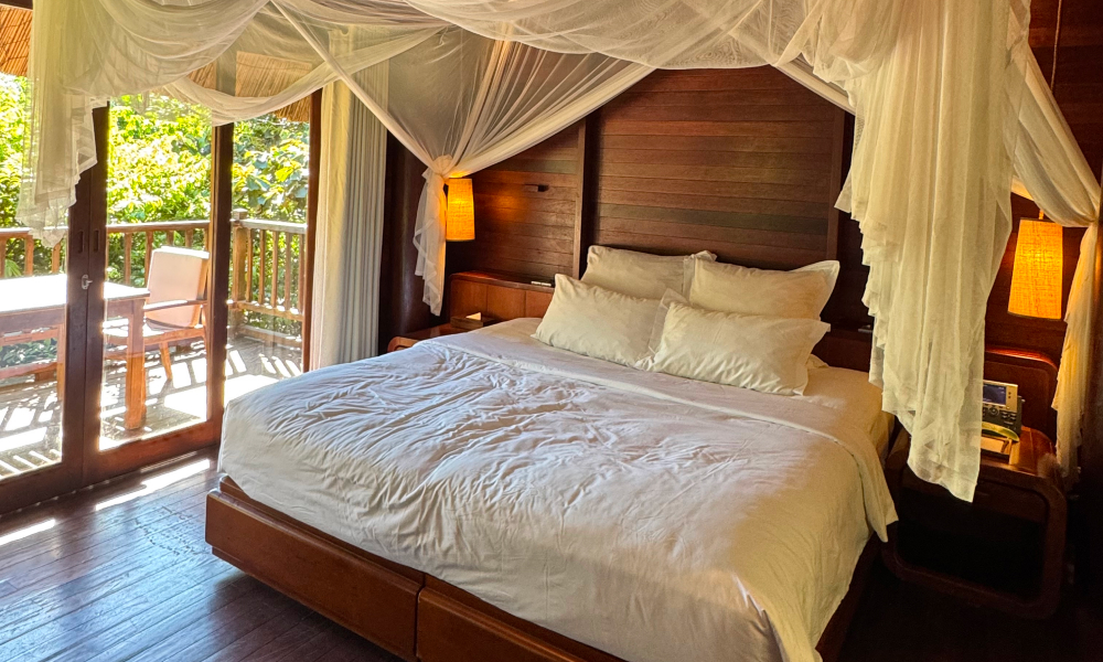 Luxury villa bedroom interior with king bed and natural light at L'Alya Ninh Van Bay Vietnam